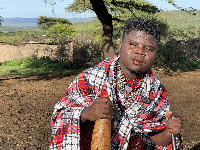 Wode Maya with cow blood in his hand