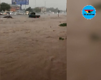 A vehicle submerged in the floodwaters at Kaneshie