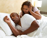 Loud snoring and repetitive pauses in breathing at night night due to blockages in the airway