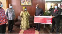 Chief of Staff Frema Ashkar receiving the donation from Senior Executives of UBA