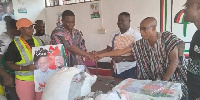 Alex Kwaku Asafo Agyei presenting the campaign materials to the NDC executives