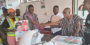 Alex Kwaku Asafo Agyei presenting the campaign materials to the NDC executives