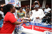 Mrs Ursula Owusu-Ekuful hands over forms to party executives