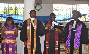 Rev. Amoako Nyarko (2nd right) prays for Rev. Maxwell Johnson Obodai Sai (2nd left)