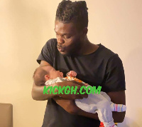 Thomas Partey with his baby