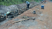 Labourers busily working on the road