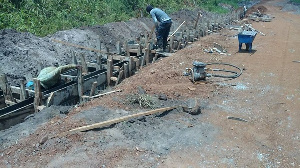 Labourers busily working on the road