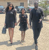 A photo of Stephen Appiah, wife and daughter