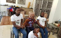 Ayisi-Boateng  in a picture with three men wearing NDC T-shirts