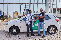 The driver receiving his car from the Bolt team