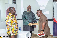 Joe Ghatey shaking the hands of some of the executives after the meeting