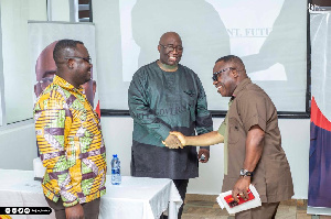 Joe Ghatey shaking the hands of some of the executives after the meeting