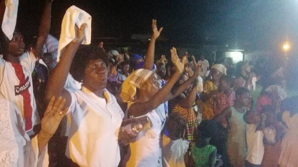 Some residents praying during the service