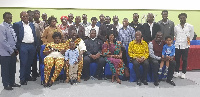 H. E. Dr Joseph Agoe, sitting in the middle, flanked by others