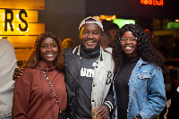 OB Amponsah sandwiched by ladies at the event