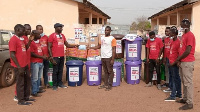 Lawyer Lamtiig Apanga presenting some items to the Nabdam District