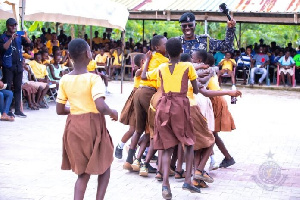 The IGP engaging in a fun time with the school children