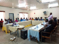 Upper West Regional Directo of NHIA addressing stakeholders at the meeting