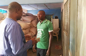 George Oduro interacting with a farmer at Chuchuliga