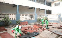 A team from Zoomlion Ghana Limited fumigating the school