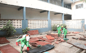 A team from Zoomlion Ghana Limited fumigating the school