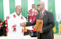 Moses Kwesi Baiden Jr. (right),  President for MOBA, at the induction ceremony