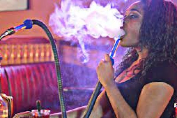 A lady smoking Shisha