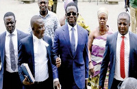 Dr Stephen Kwabena Opuni [M] with his lawyers