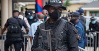 File Photo: Policemen at a scene