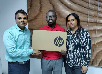 Human Rights Reporters Ghana receiving a brand new HP Laptop Computer