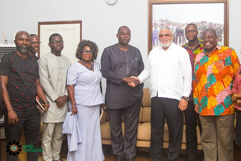 Former President John Rawlings in a handshake with Dr. Ekwow Spio-Garbrah