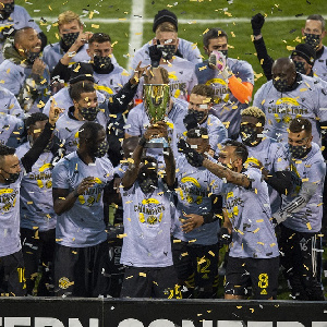 Jonathan Mensah and his Columbus Crew teammates celebrate league win