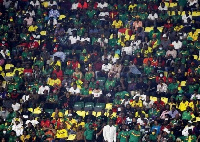 A photo of football fans at the sports stadium