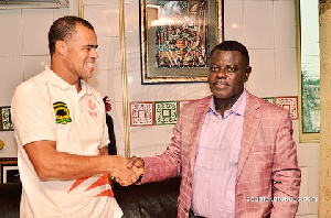 Steve Pollack in a hand shake with Dr Kwame Kyei