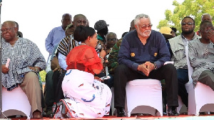 Anita Desoso kneeling before JJ Rawlings yesterday