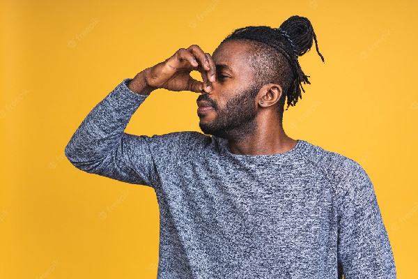 File photo of a man holding his nose