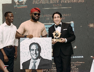 Maher Kheir, Lebanon Ambassador, right, with his awards