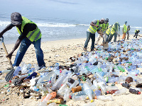 Beach cleaners tidying up the shore