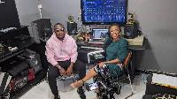 DJ Vyrusky seated with Doreen Avio