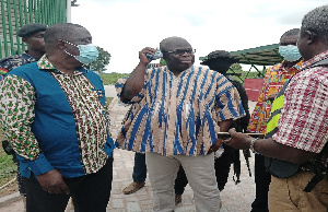 The Consultant (Right) explaining to the Minister (Left) and other officials