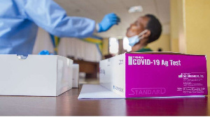 A health worker collects a sample for Covid-19 testing