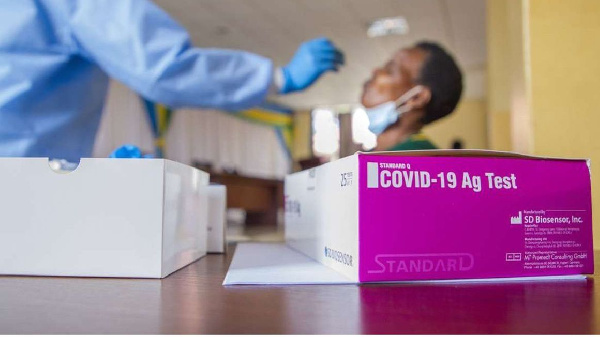 A health worker collects a sample for Covid-19 testing