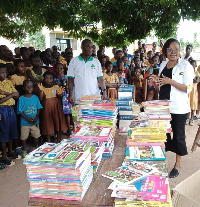 Afua Adoboe making the presentation of the books