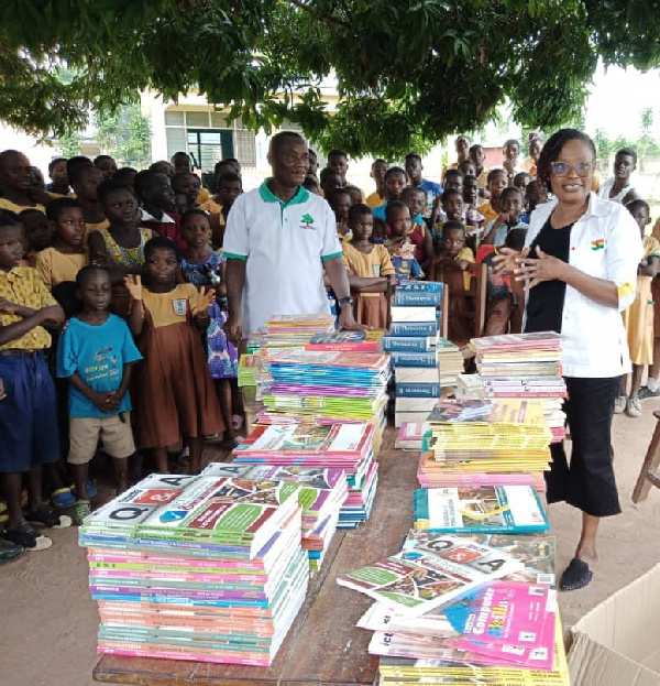 Afua Adoboe making the presentation of the books