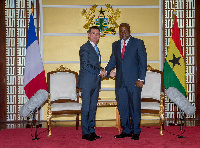 French Prime Minister, Manuel Carlos Valls Galfetti in a handshake with President Mahama