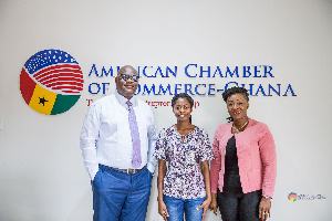 Francisca shares a photo with some workers at the Chamber