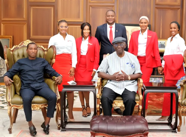 Former President Kufuor with Kenpong and some staff of Kenpong Travel and Tours