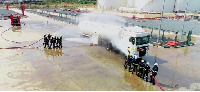 The team using emergency hydration systems to cool down the truck during the exercise