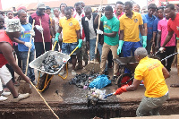 People cleaning their environment