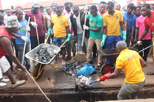 People cleaning their environment